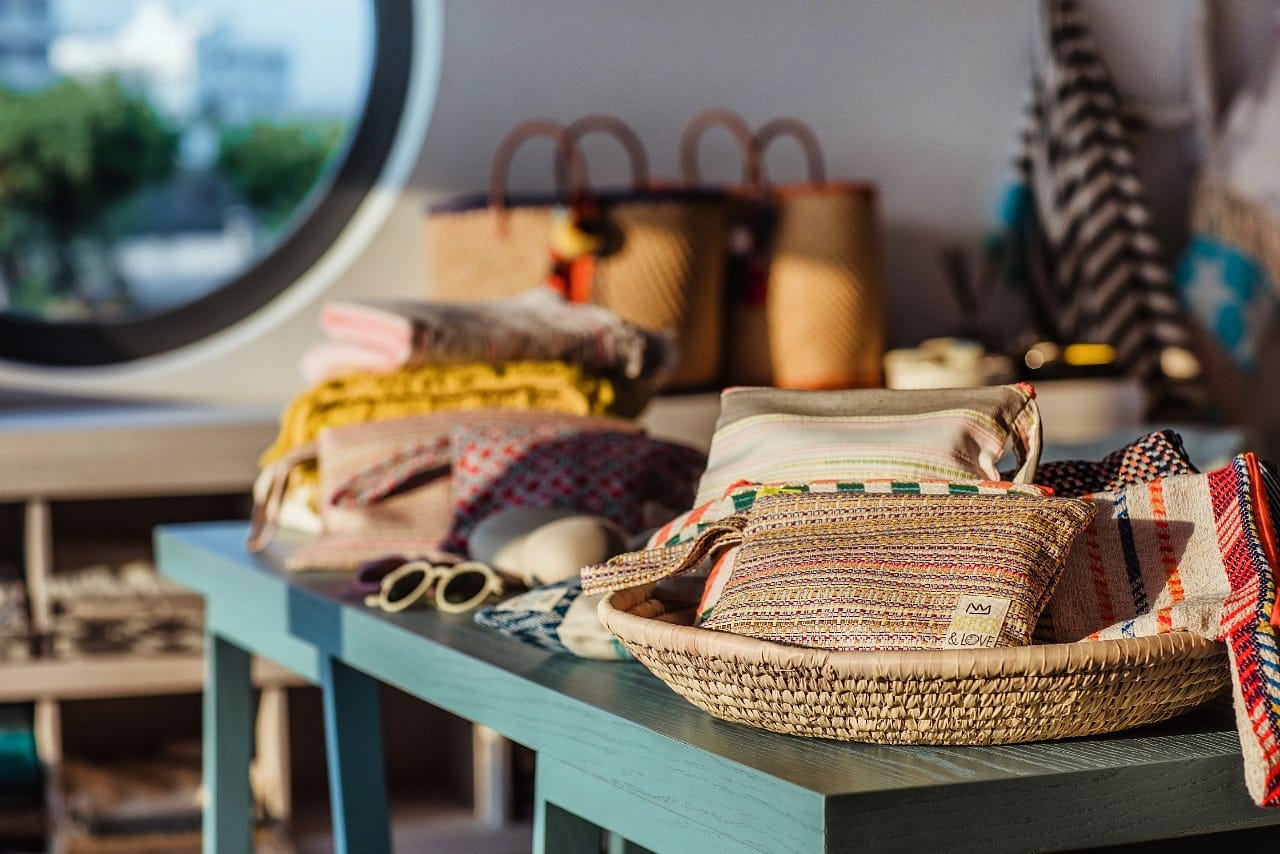 Woven baskets and cloths on a table with a blurred background